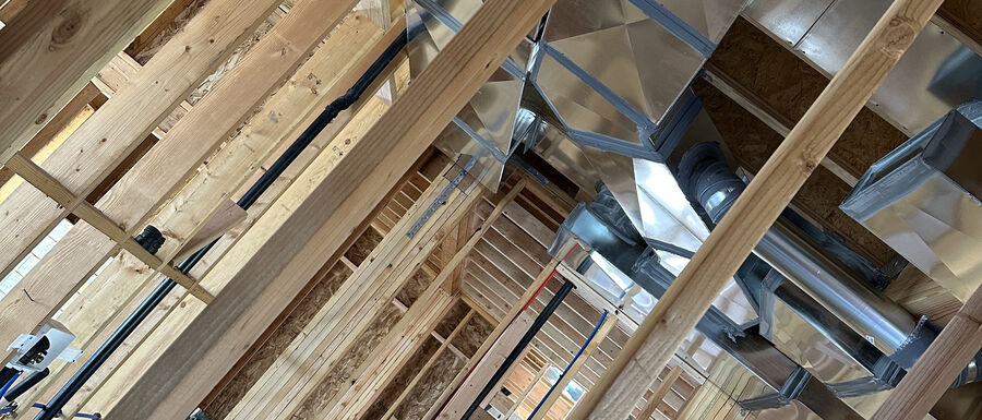 New construction duct rough-in coordinated with framing before drywall