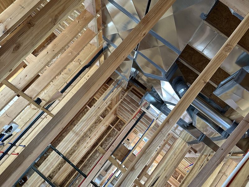 Duct system and return air pathways in a home under construction